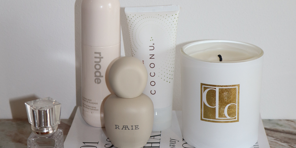 Coconu body oil beside skincare products in a morning routine setting, representing organic body care as a daily wellness ritual
