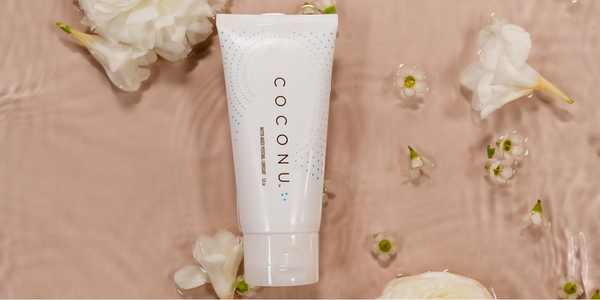 Clean personal care products arranged on a minimal surface, representing pH balance and intimate wellness