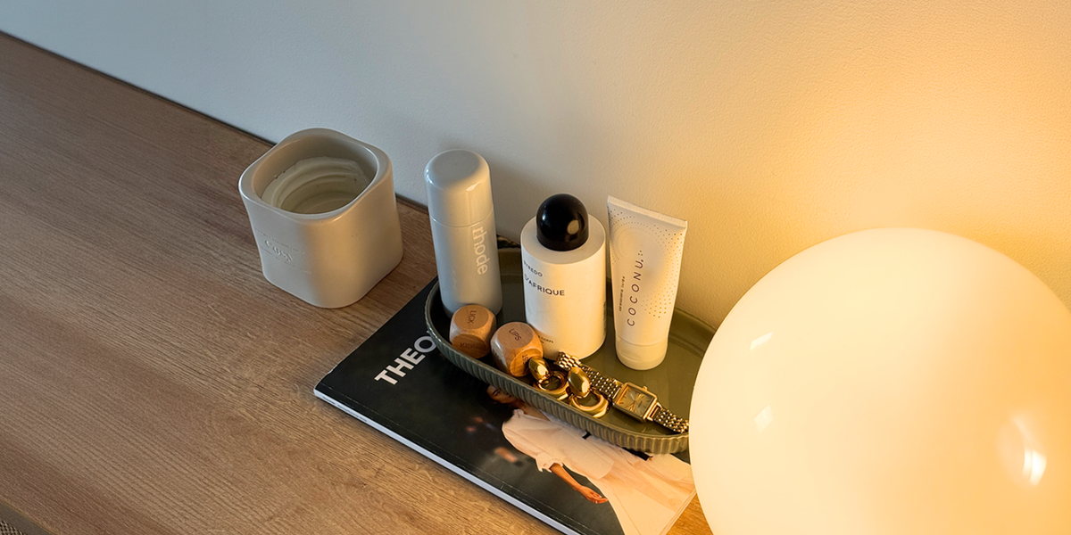 Minimal personal care products on a soft surface, representing gentle, hypoallergenic formulas for sensitive skin
