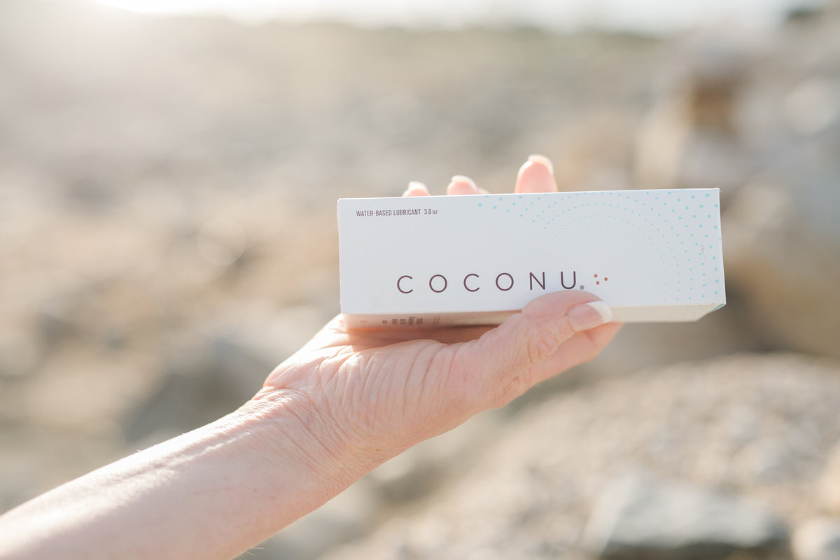Coconu water-based lubricant tube on a clean surface, representing a latex-safe and condom-compatible lubricant