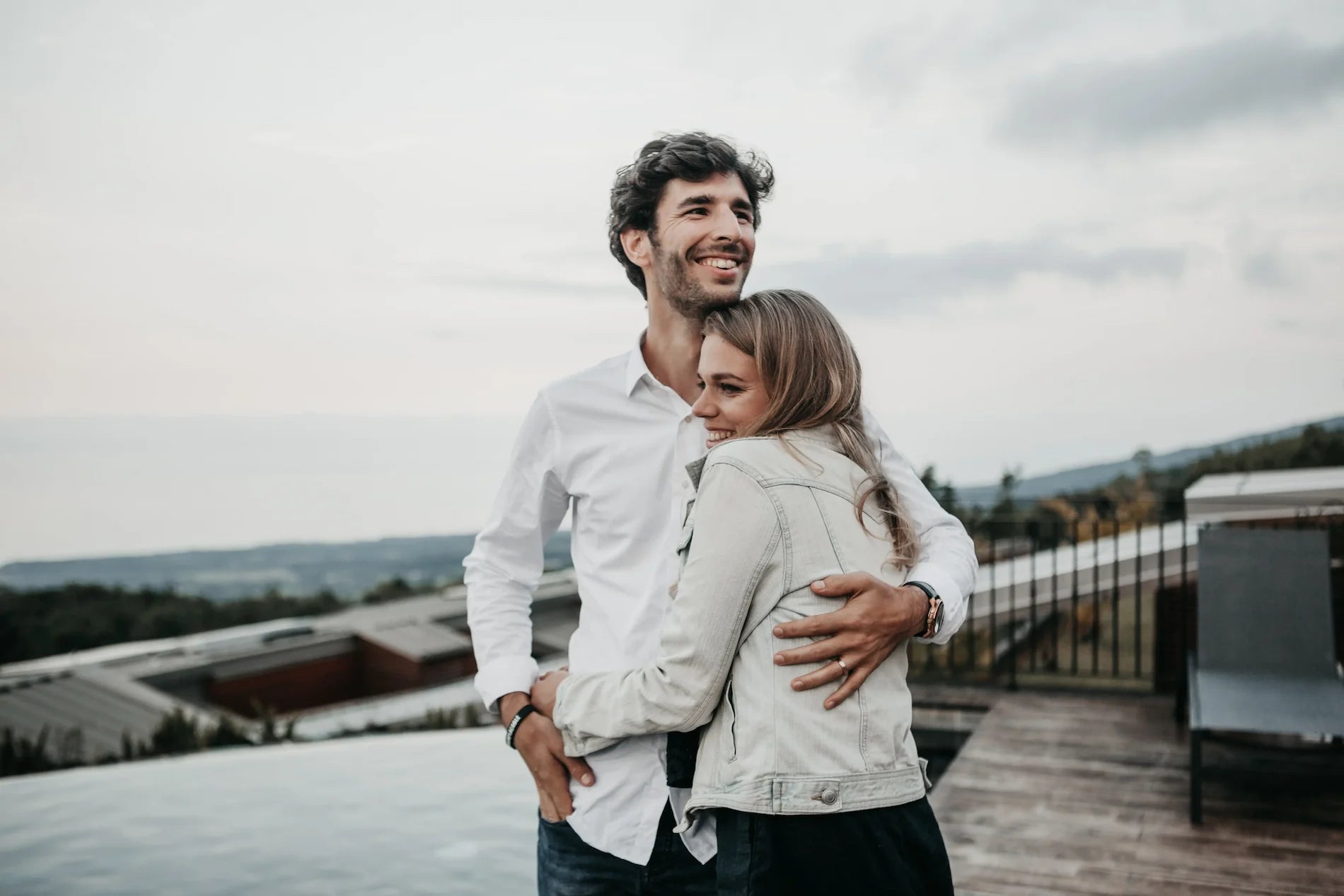 A couple smiling and embracing each other