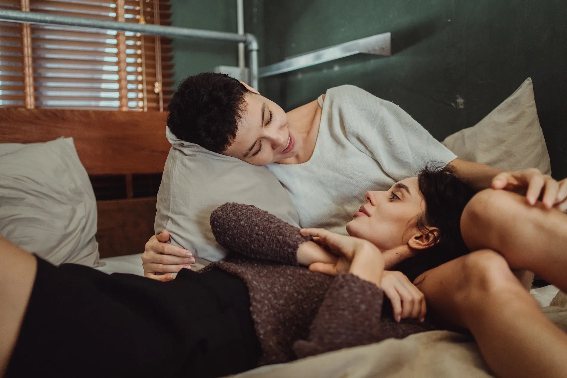A couple sharing an intimate moment on the couch