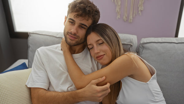 Couple sitting together calmly, representing emotional safety and openness in intimacy